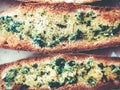 Toasts with basil and garlic close-up on a plate. Royalty Free Stock Photo