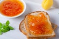 Toasts of bread with apricot jam and fresh fruits with mint Royalty Free Stock Photo