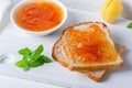 Toasts of bread with apricot jam and fresh fruits with mint Royalty Free Stock Photo