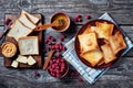 Toasts, butter, peanut butter, berries, top view