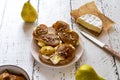 Toasts with camembert cheese and caramelised pears with walnuts and honey