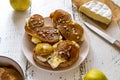 Toasts with camembert cheese and caramelised pears with walnuts and honey