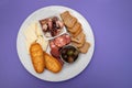 toasts with chourico and olives on dish Royalty Free Stock Photo