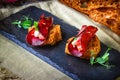 Toasts with a circle of beets, goat cheese and a piece of salmon