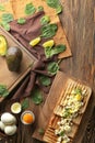 Toasts with cut boiled egg with spinach on wooden table Royalty Free Stock Photo