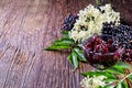 Toasts with elderberry jam and fresh berry fruits on wooden table. Royalty Free Stock Photo