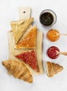 Toasts with jam and peanut paste, croissant, coffee Royalty Free Stock Photo