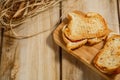 Toasts with sausage and cheese on a wooden stand. The concept of tasty and natural food. Royalty Free Stock Photo