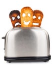Toasts with smiley face in toaster Royalty Free Stock Photo