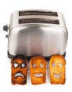 Toasts with smiley face in toaster Royalty Free Stock Photo