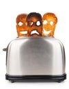 Toasts with smiley face in toaster Royalty Free Stock Photo