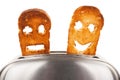 Toasts with smiley face in toaster Royalty Free Stock Photo