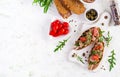 Italian bruschetta sandwiches with canned tuna, tomatoes and capers.