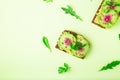 Toasts with watemelon radish, avocado and flex seeds Royalty Free Stock Photo