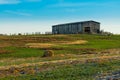 Tobacco Barn with Round Hay Bale Royalty Free Stock Photo