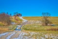 Tobacco barn sitting on a hill with snow covered path