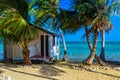 Tobacco Caye - Relaxing at Cabin or bungalow on small tropical island at Barrier Reef with paradise beach, Caribbean Sea, Belize, Royalty Free Stock Photo