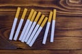 Tobacco cigarettes on wooden table Royalty Free Stock Photo