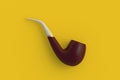 Tobacco pipe on yellow background