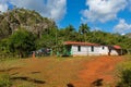 Tobacco plantation with hut and palms in the background. The Vinales Valley Valle de Vinales, popular tourist destination. Pinar Royalty Free Stock Photo