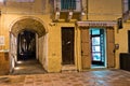 Tobbaco shop and narrow passage at Carloforte harbor, San Pietro island, Sardinia