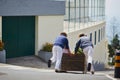 Toboggan riders moving cane sledge downhill on the streets of Funchal, Madeira island Royalty Free Stock Photo