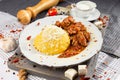 Tochitura is a traditional Romanian dish made from beef and pork served with polenta