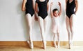 Today a beginner, tomorrow a superstar. a group of young ballerinas teaching a little girl ballet in a dance studio. Royalty Free Stock Photo