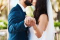 Today they chose commitment. an unrecognizable newlywed couple kissing while holding hands on their wedding day. Royalty Free Stock Photo