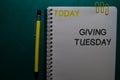 Today - Giving Tuesday write on a Book isolated on Office Desk Royalty Free Stock Photo