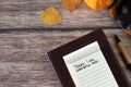 Today I am thankful for, handwritten text in small notebook, holy bible, pumpkin, and autumn leaves on wooden table Royalty Free Stock Photo