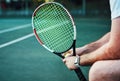 Today I will advance to a new level. Closeup shot of an unrecognisable man holding a tennis racket and ball on a tennis Royalty Free Stock Photo