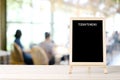 TodayÃ¢â¬â¢s menu blackboard, sign board, on table at  blur coffee shop, restaurant, with people background, Blank chalkboard mock up Royalty Free Stock Photo