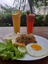 Today`s menu is fried rice with special beef eye egg. And two fresh juices
