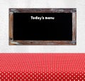 Today's menu on vintage chalk board over empty red polka dot tab