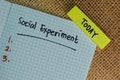 Today Social Experiment write on a book isolated on Wooden Table Royalty Free Stock Photo