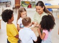 Today were learning about making music. Shot of a woman teaching her class about musical instruments. Royalty Free Stock Photo