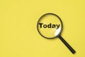 Today wording inside of Magnifier glass on yellow background for focus current situation , positive thinking mindset concept