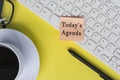 Today's agenda text on sticky note with computer keyboard on yellow background. Royalty Free Stock Photo