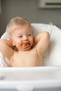 Toddler baby boy child eating fruit with dirty messy face Royalty Free Stock Photo