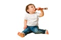 Toddler baby with a flute wind musical instrument on a studio isolated Royalty Free Stock Photo