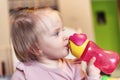 Toddler baby girl drinking water from bottle Royalty Free Stock Photo