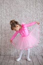 Toddler ballerina girl in ballet tutu skirt.