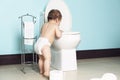 Toddler in bathroom look at the toilet Royalty Free Stock Photo