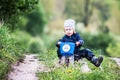 Child riding bike through a puddle creating a splash Royalty Free Stock Photo