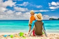 Toddler boy on beach with father