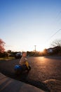 Toddler boy child riding tricycle on road