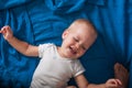 Toddler boy crying on bed close-up. Royalty Free Stock Photo