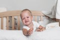 Toddler boy crying on bed close-up. Royalty Free Stock Photo