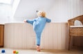 Toddler boy in a dangerous situation in the bathroom. Royalty Free Stock Photo